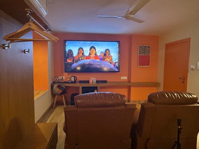 Private theatre room for couples with recliners and a big screen