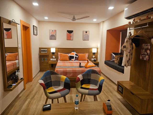 Theatre room lounge area with bed and designer chairs