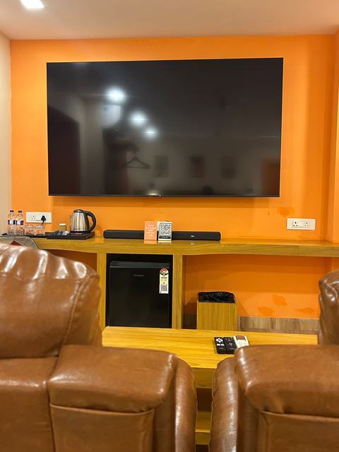Private theatre room with leather recliners facing a big screen