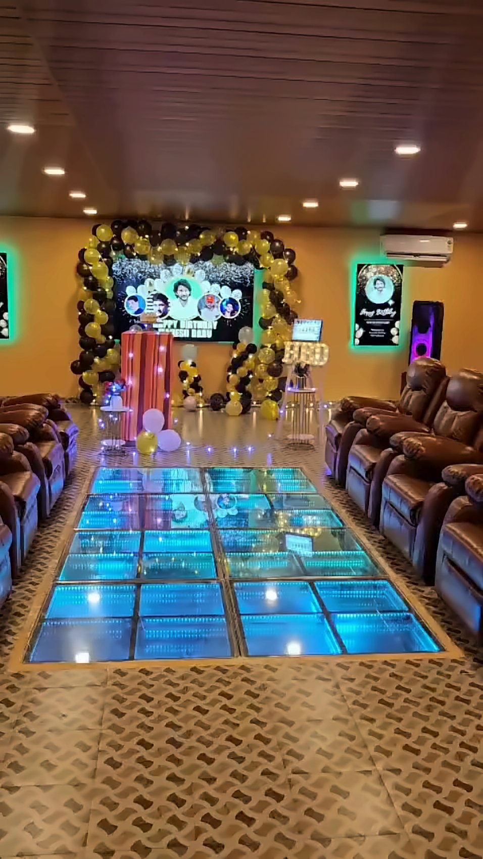 Party hall with a colour-changing LED dance floor and recliners